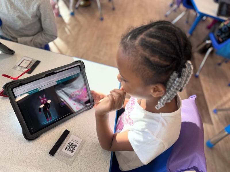 A student reviewing their work on their iPad