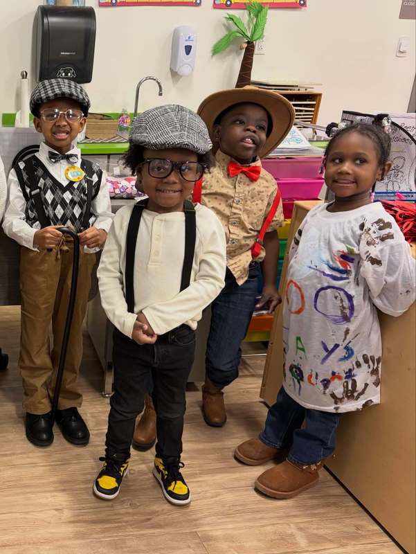 Four ELV students dressed up for 100th Day Celebration