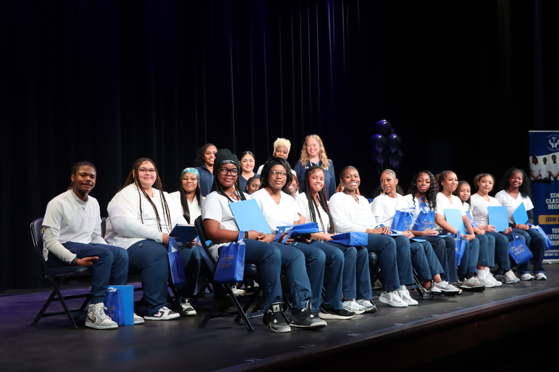 Students posing with instructors and Assistant Principal Anne Obradovich after the ceremony.