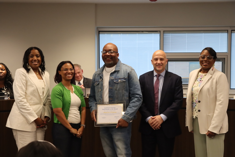 Maurice Primous, posing with certificates alongside Chris Papouras, Gabrielle Kelly, LaWanda Prettyman and Velma Bell-Clark.