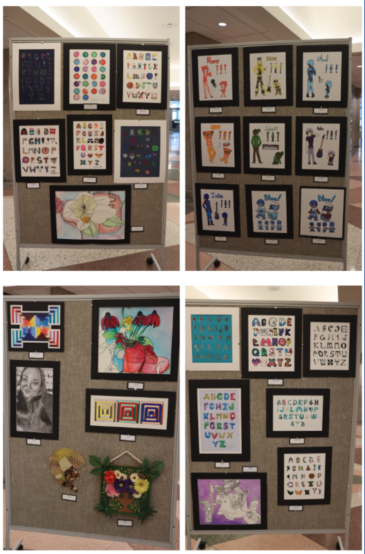 Student Artwork displays in the Auditorium Lobby. Many of the featured pieces are interpretations of the Alphabet. There are also self portraits and colorful anime characters.