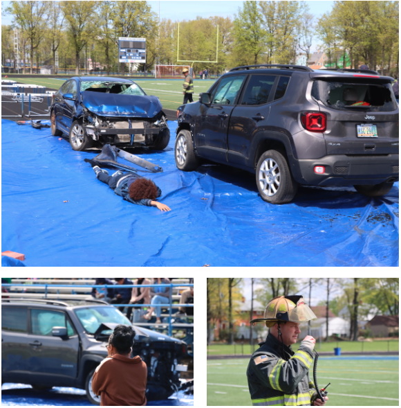 Euclid firefighters use rescue tools to remove a car door during a simulated crash demonstration, with students watching from the bleachers as part of a safety awareness event.