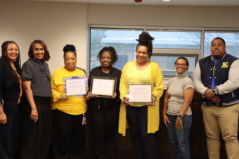 LaToya Dixon, Lena Wilson and Erica Durden posing with certificates alongside Karen Brown, Gabrielle Kelly, Cherree Mason and  Mario Snowden.