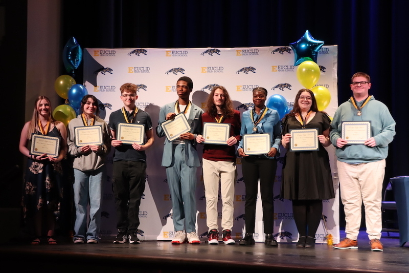 Seniors graduating as Distinguished Scholars with certificates and their Graduation Medals.