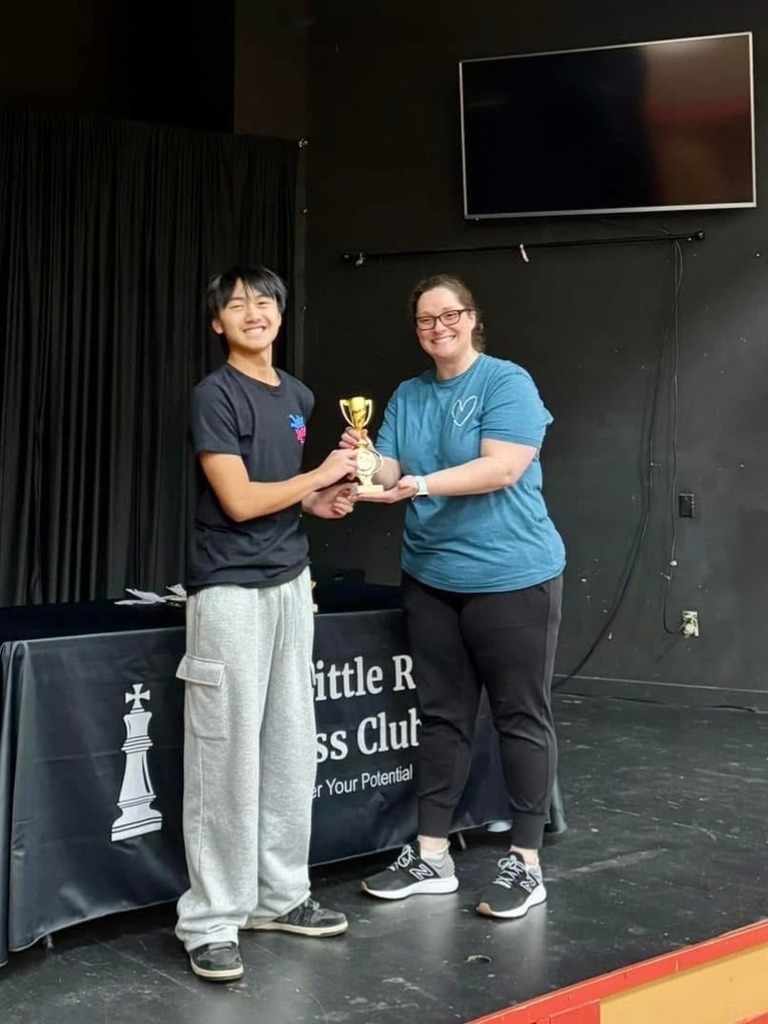 student at chess tournament