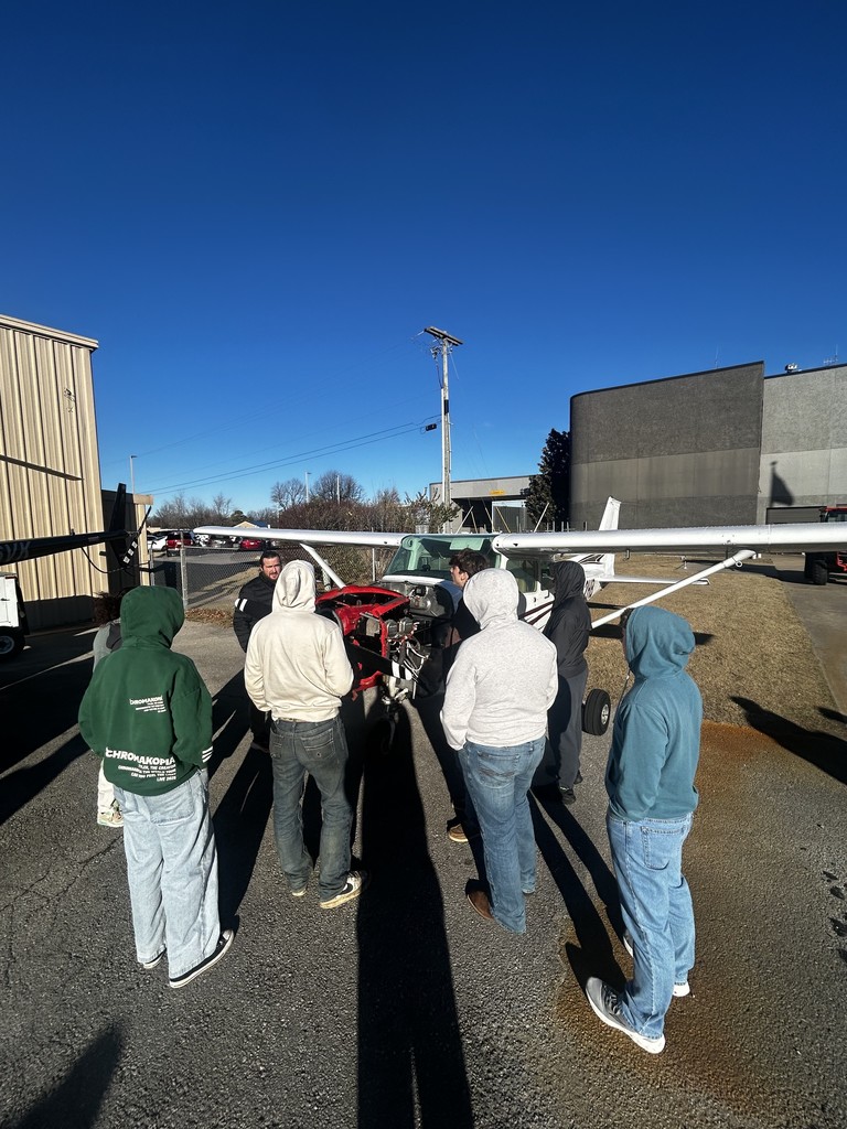 students touring airport