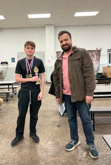students posing at chess tournament