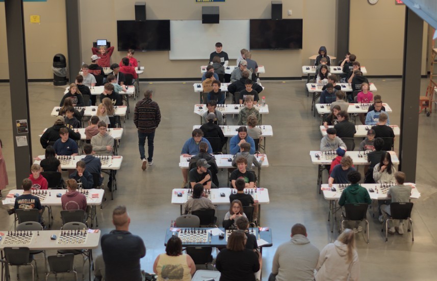 students posing at chess tournament