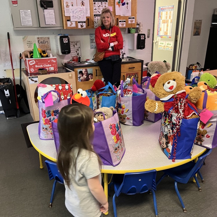 child looking at gifts