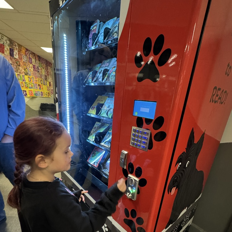 student at vending machine 