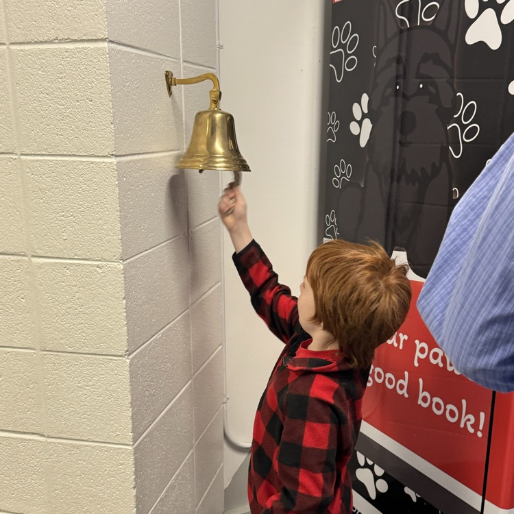 student ringing bell