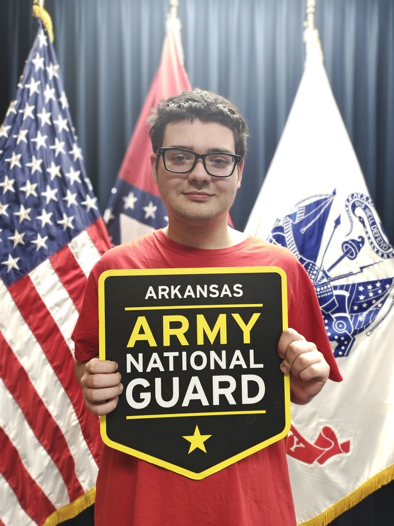 student with national guard sign