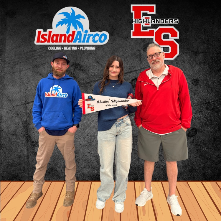 student holding banner