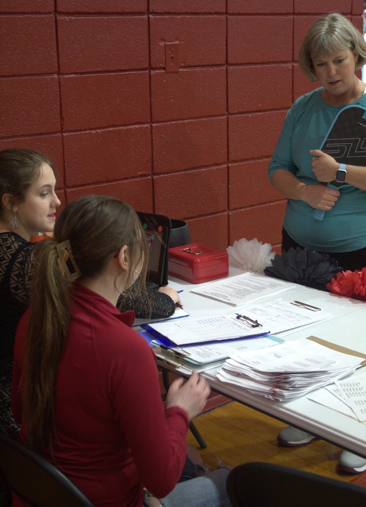 Holley and Madeline Registering Stacy