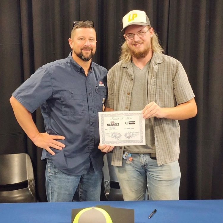 student and adult posing 