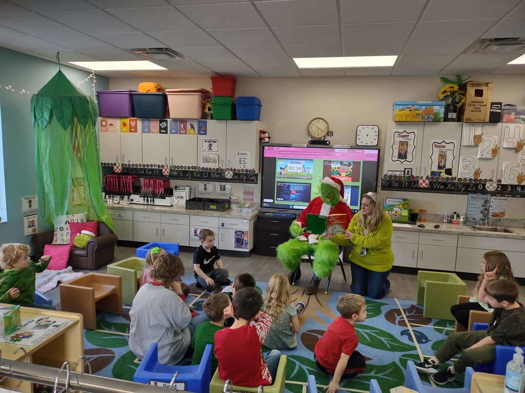 The Grinch reading to PreK students