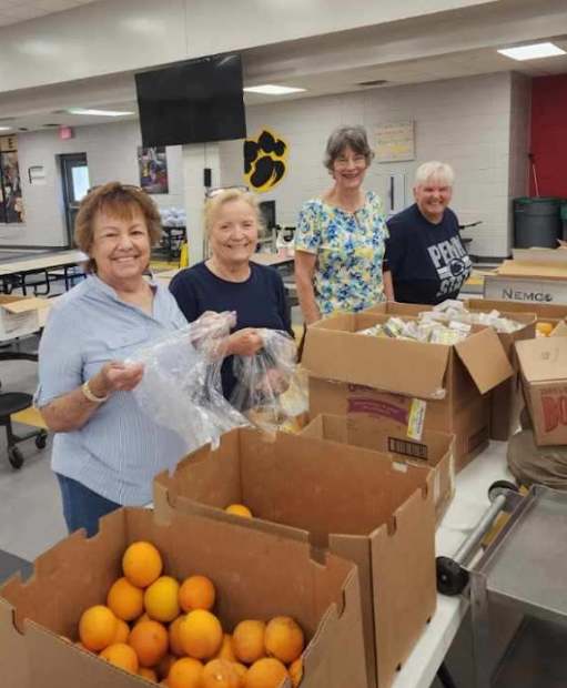 Picture of volunteers prepping meals