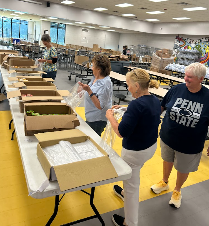 Picture of volunteers  prepping meals