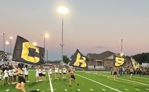 CHS letters running through field
