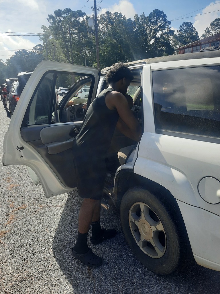 Students loading food bank items