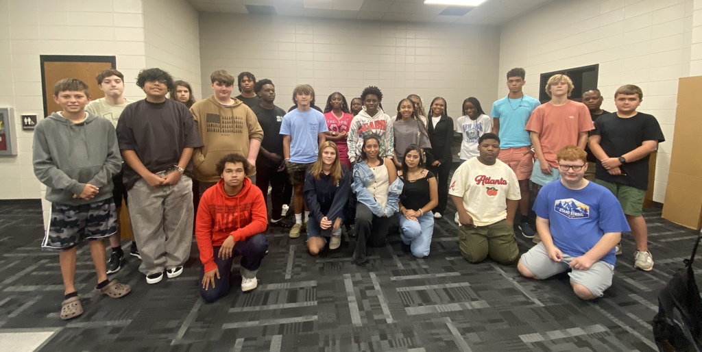 Star with a group of 9th grade students