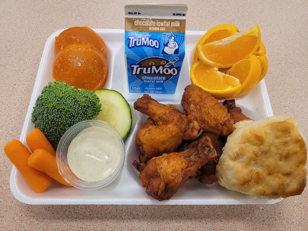 Hot Wings, Biscuit, Veggies with Dip, Sweet Potato Patties, Orange slices, and Choice of Milk