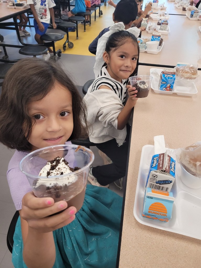 Students at CES with Chocolate Pudding 