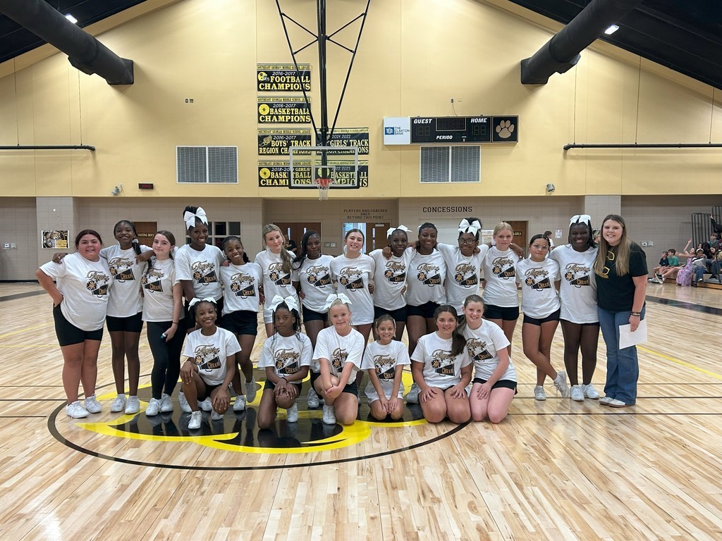 CMS Cheerleaders with coach at pep rally