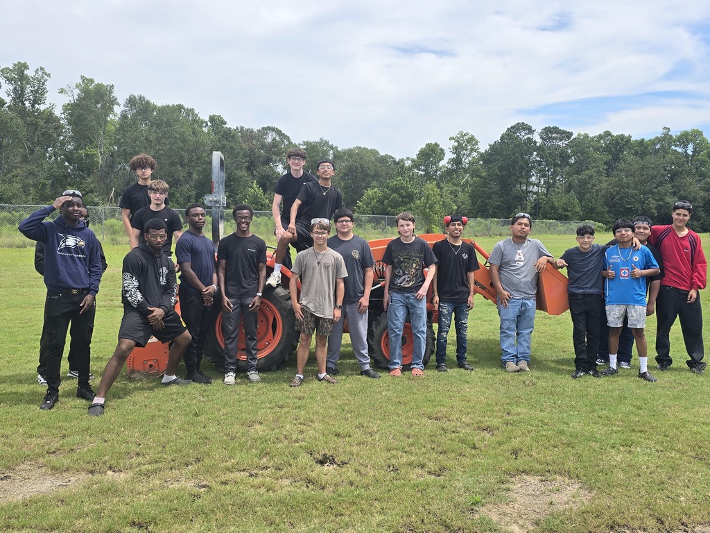 Picture showing 🚜✨ Students in Mr. Turner's Basig Ag class learned how to properly maintain and operate a tractor — and even got behind the wheel to demonstrate their skills! 👩‍🌾👨‍🌾  To top it off, Mr. Curry, our CHS Business teacher, drove a tractor for the VERY first time — and he did a great job! 🙌👏  🐯Proud of our Claxton Tigers reppin’ that Black & Gold 🖤💛  #ClaxtonTigers #AgEducation #HandsOnLearning #BlackAndGoldPride #FutureFarmers #TheDen