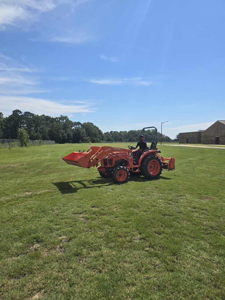 Picture showing 🚜✨ Students in Mr. Turner's Basig Ag class learned how to properly maintain and operate a tractor — and even got behind the wheel to demonstrate their skills! 👩‍🌾👨‍🌾  To top it off, Mr. Curry, our CHS Business teacher, drove a tractor for the VERY first time — and he did a great job! 🙌👏  🐯Proud of our Claxton Tigers reppin’ that Black & Gold 🖤💛  #ClaxtonTigers #AgEducation #HandsOnLearning #BlackAndGoldPride #FutureFarmers #TheDen