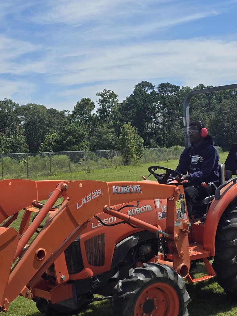 Picture showing 🚜✨ Students in Mr. Turner's Basig Ag class learned how to properly maintain and operate a tractor — and even got behind the wheel to demonstrate their skills! 👩‍🌾👨‍🌾  To top it off, Mr. Curry, our CHS Business teacher, drove a tractor for the VERY first time — and he did a great job! 🙌👏  🐯Proud of our Claxton Tigers reppin’ that Black & Gold 🖤💛  #ClaxtonTigers #AgEducation #HandsOnLearning #BlackAndGoldPride #FutureFarmers #TheDen