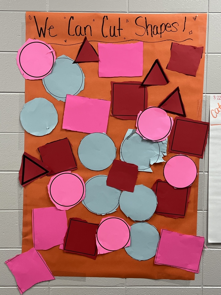 PreK students cutting shapes