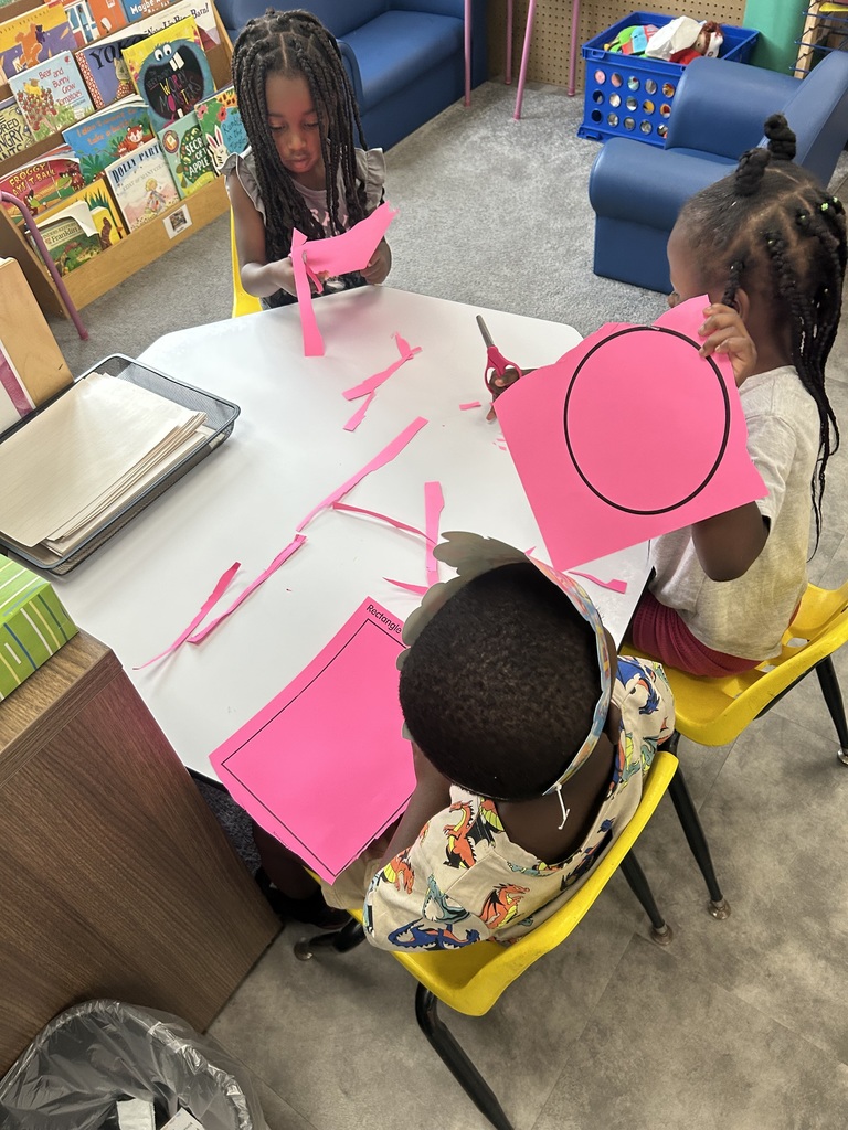 PreK students cutting shapes