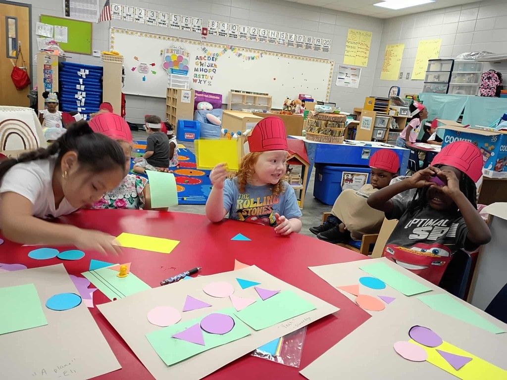 PreK students cutting shapes