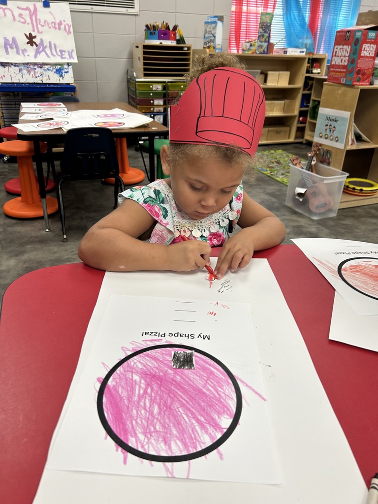 PreK students cutting shapes