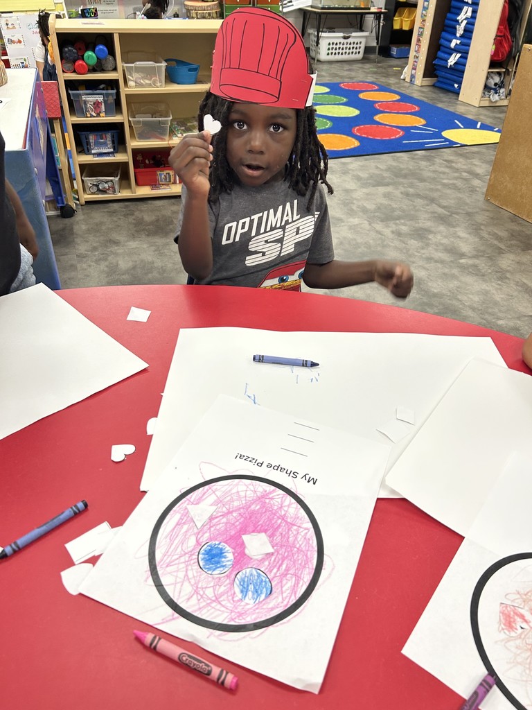 PreK students cutting shapes