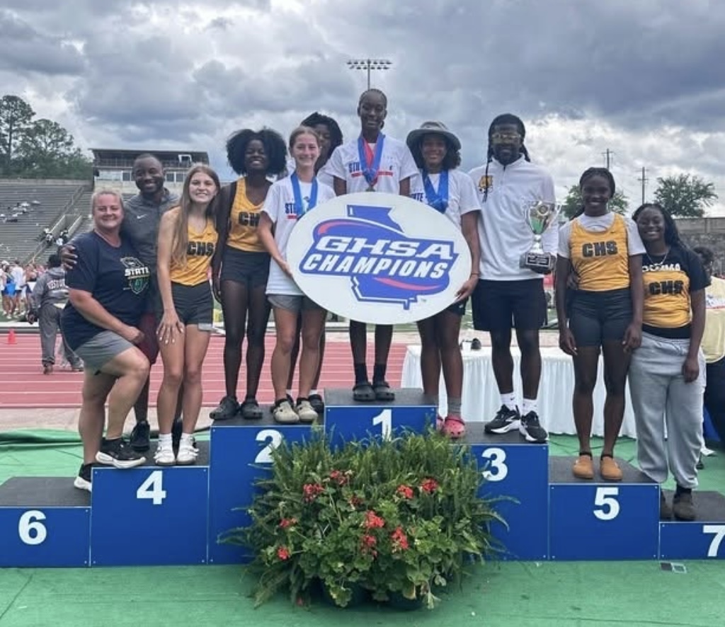 Girls Track State Championship Group Picture with Coaches