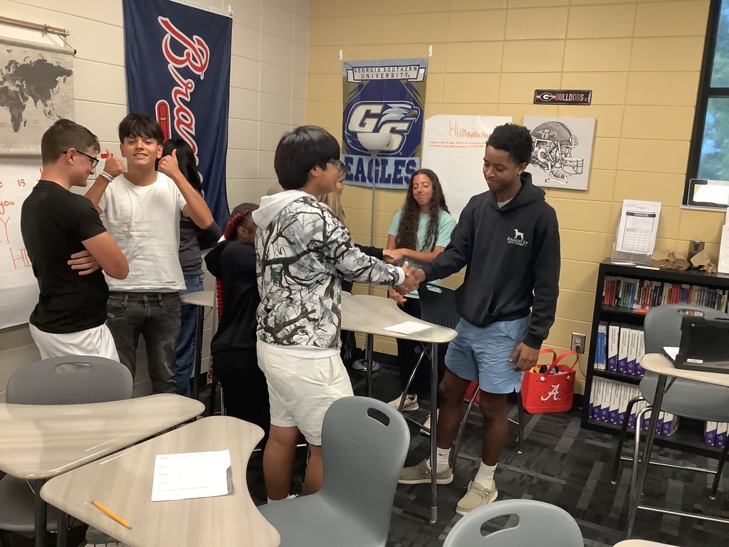 Image showing 📚✨ Coach Lanier’s Government classes have been diving deep into the Executive Branch and the roles of the President! 🇺🇸 As part of their unit on foreign policy, students became leaders of fictional countries 🌍—representing economic aid, military aid, humanitarian aid, and technology. Each country first reflected on its own strengths 💪 and weaknesses 🤔, then worked with others to find ways to cooperate. The ultimate challenge? 🤝 To create a treaty that benefits all four nations—ensuring balance, fairness, and collaboration without one country dominating the rest. To prepare, students explored real-world examples like the Marshall Plan, 9/11 & NATO, and the Lend-Lease Act, connecting history to today’s global relationships. 🌐 We’re so proud of our Tigers for learning how cooperation and diplomacy shape the world! 🐅💛🖤 #ClaxtonTigers #GovernmentClass #ExecutiveBranch #FutureLeaders #ForeignPolicy #Teamwork #LearningByDoing #BlackAndGold
