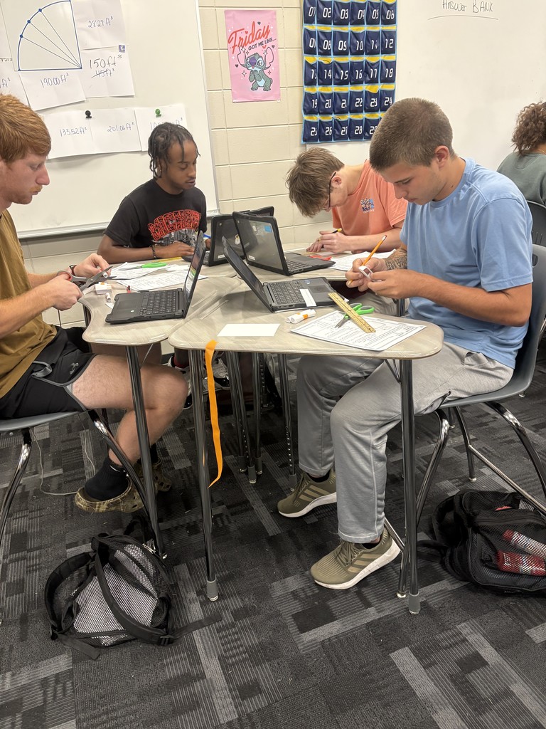 Image showing 📚🤖 In Mrs. Selph’s and Mrs. Cook’s College Readiness class, we’re taking on CRM.GSR.5.4 — using formulas to calculate the volume and surface area of 3D shapes like spheres, prisms, cylinders, pyramids, and cones. But we’re not just crunching numbers… ✏️➗ We’re building robots out of 3D shapes 🤖✨ and proving the math behind them through their surface area and volume! 🐅💛🖤 Go Claxton High School Tigers — black and gold pride all the way! 🖤💛🐅 #CHSTigers #BlackAndGold #CollegeReadiness #STEM #3DShapes #MathInAction #FutureReady