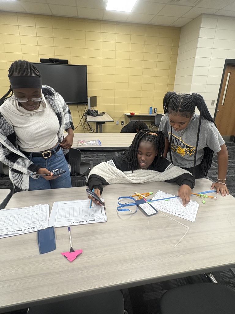 Image shows 🎯🏹 In Mrs. Selph's and Mrs. Cook’s College Readiness Math class, our CHS Tigers became engineers for the day! Students designed their own bow & arrow models, then identified independent and dependent variables through trial testing. 📊 After collecting their data, they built bar graphs and analyzed results, connecting scientific thinking, math skills, and real-world applications in a hands-on engineering challenge.  🐾💛🖤 We are proud of our Tigers for taking aim at success through learning and discovery!  #ClaxtonHigh #TigerPride #STEM #HandsOnLearning #BlackAndGold #FutureEngineers