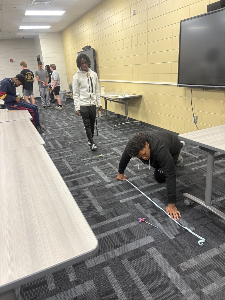 Image shows 🎯🏹 In Mrs. Selph's and Mrs. Cook’s College Readiness Math class, our CHS Tigers became engineers for the day! Students designed their own bow & arrow models, then identified independent and dependent variables through trial testing. 📊 After collecting their data, they built bar graphs and analyzed results, connecting scientific thinking, math skills, and real-world applications in a hands-on engineering challenge.  🐾💛🖤 We are proud of our Tigers for taking aim at success through learning and discovery!  #ClaxtonHigh #TigerPride #STEM #HandsOnLearning #BlackAndGold #FutureEngineers