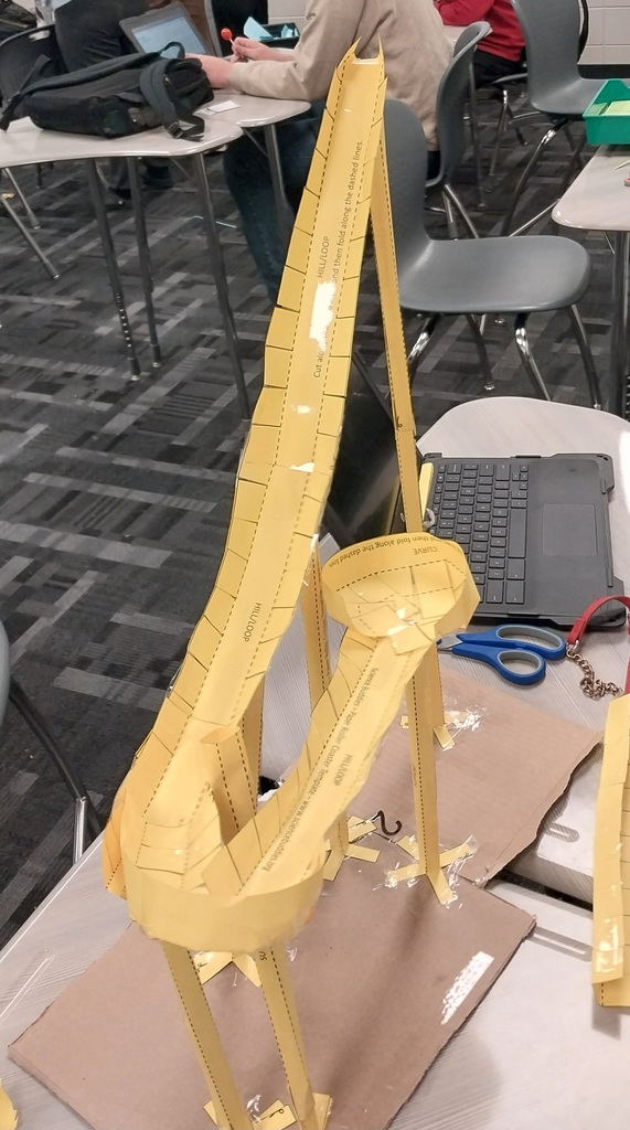 Image showing 🎢🎢 Coach Transue’s Advanced Algebra students are taking math to new heights! 🎢🎢 This week, they wrapped up their unit on quadratic equations with an exciting Summative Assessment Challenge — using parabolas to design and build marble roller coasters! 🎢💫 Students had to create and adjust their roller coasters to meet one of three challenges: 1️⃣ Successfully pass through a vertical loop 2️⃣ Successfully pass through a horizontal loop 3️⃣ Successfully make it over an incline Hands-on learning meets creative problem solving — and these Tigers were up for the challenge! 💪🐯🖤💛 #Tigers #STEM #MathInAction #HandsOnLearning #EvansCountyCharter #AdvancedAlgebra #QuadraticEquations #LearningIsFun #BlackAndGoldPride