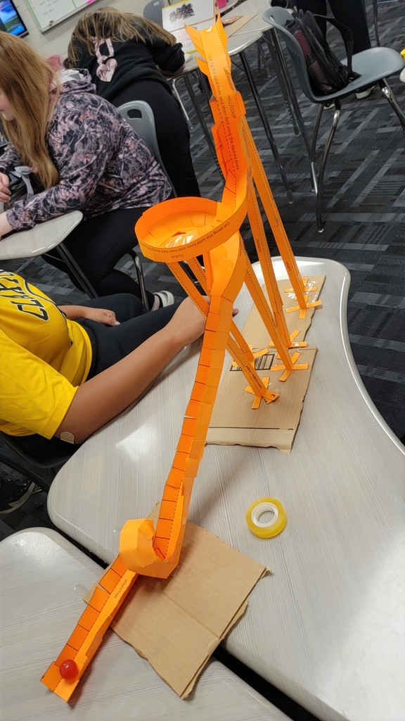 Image showing 🎢🎢 Coach Transue’s Advanced Algebra students are taking math to new heights! 🎢🎢 This week, they wrapped up their unit on quadratic equations with an exciting Summative Assessment Challenge — using parabolas to design and build marble roller coasters! 🎢💫 Students had to create and adjust their roller coasters to meet one of three challenges: 1️⃣ Successfully pass through a vertical loop 2️⃣ Successfully pass through a horizontal loop 3️⃣ Successfully make it over an incline Hands-on learning meets creative problem solving — and these Tigers were up for the challenge! 💪🐯🖤💛 #Tigers #STEM #MathInAction #HandsOnLearning #EvansCountyCharter #AdvancedAlgebra #QuadraticEquations #LearningIsFun #BlackAndGoldPride