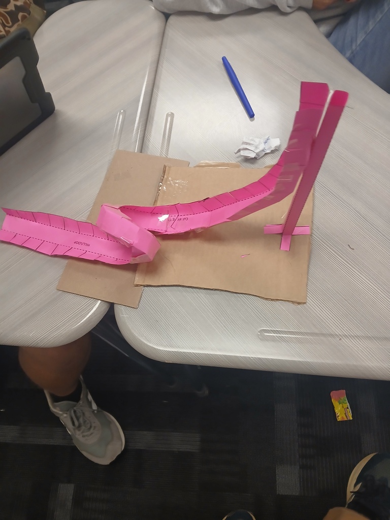Image showing 🎢🎢 Coach Transue’s Advanced Algebra students are taking math to new heights! 🎢🎢 This week, they wrapped up their unit on quadratic equations with an exciting Summative Assessment Challenge — using parabolas to design and build marble roller coasters! 🎢💫 Students had to create and adjust their roller coasters to meet one of three challenges: 1️⃣ Successfully pass through a vertical loop 2️⃣ Successfully pass through a horizontal loop 3️⃣ Successfully make it over an incline Hands-on learning meets creative problem solving — and these Tigers were up for the challenge! 💪🐯🖤💛 #Tigers #STEM #MathInAction #HandsOnLearning #EvansCountyCharter #AdvancedAlgebra #QuadraticEquations #LearningIsFun #BlackAndGoldPride