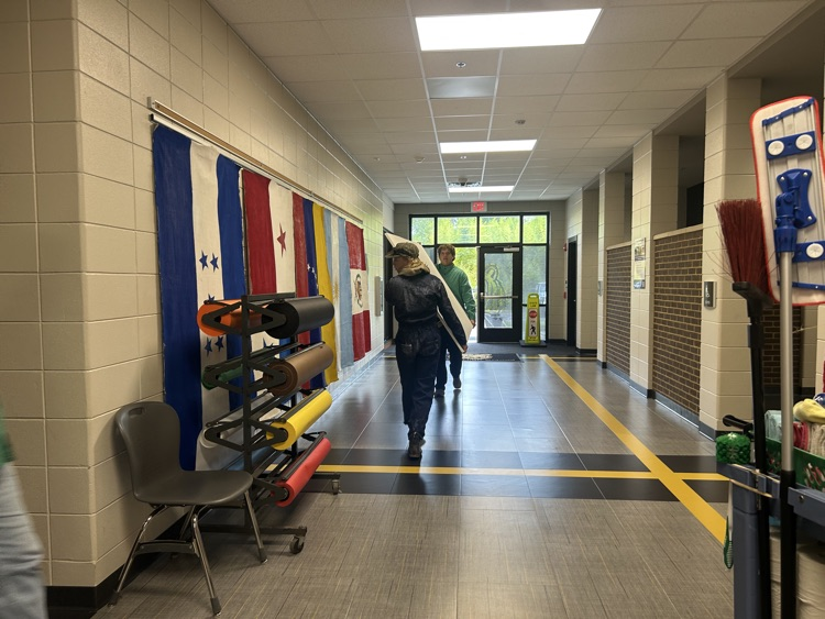 carrying canvases to art