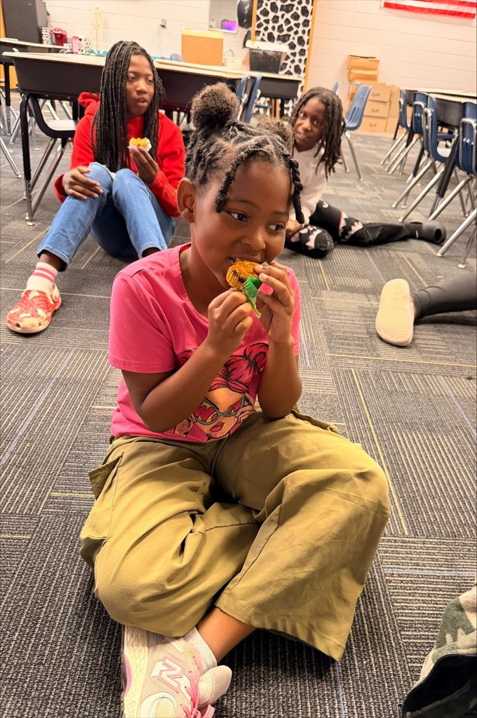 Student with a Pumpkin Chocolate Chip Muffin