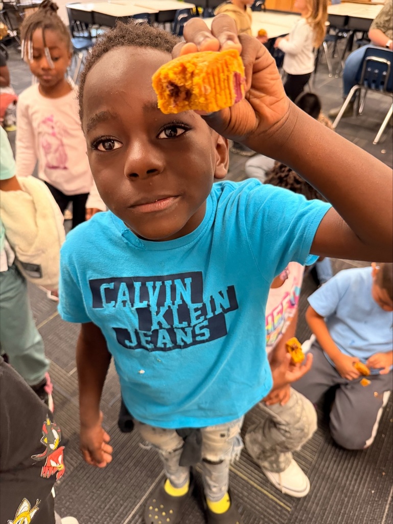 Student with a Pumpkin Chocolate Chip Muffin
