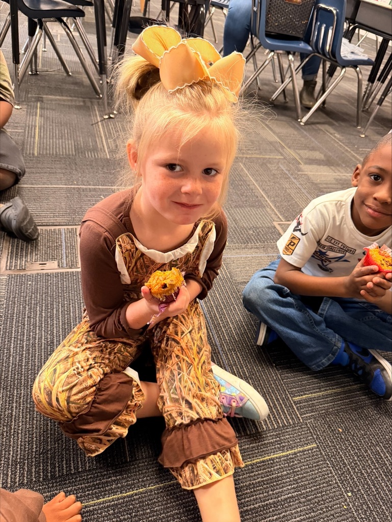 Student with a Pumpkin Chocolate Chip Muffin