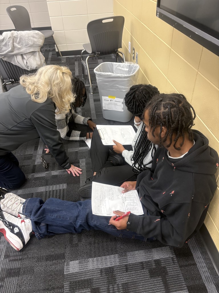 Image showing WHO 🔪 WHAT 🧠 WHERE 🧐 Students were deep into the ultimate math mystery! Ms. Selph's class turned into a detective agency, working in groups to solve the case of "The Murder of Ms. Selph." 🖤💛 To crack the clues—the suspect, the weapon, and the location—students had to correctly solve challenging conditional probability problems hidden throughout the room! It was a fantastic, hands-on application of complex math concepts. Great work, detectives! Way to use your brains to save the day (and learn math)! 🖤💛 #ConditionalProbability #MathMystery #SelphClass #EngagingMath #STEM 🔎