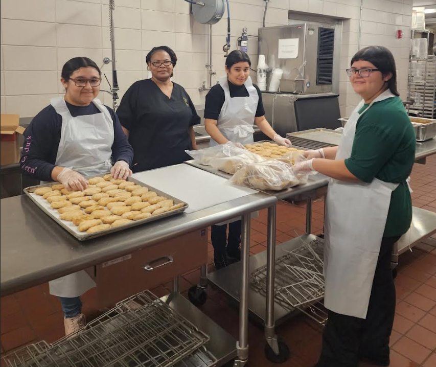 Students from the Culinary Production class helping prepare breakfast foods in the CMS/CHS Kitchen.
